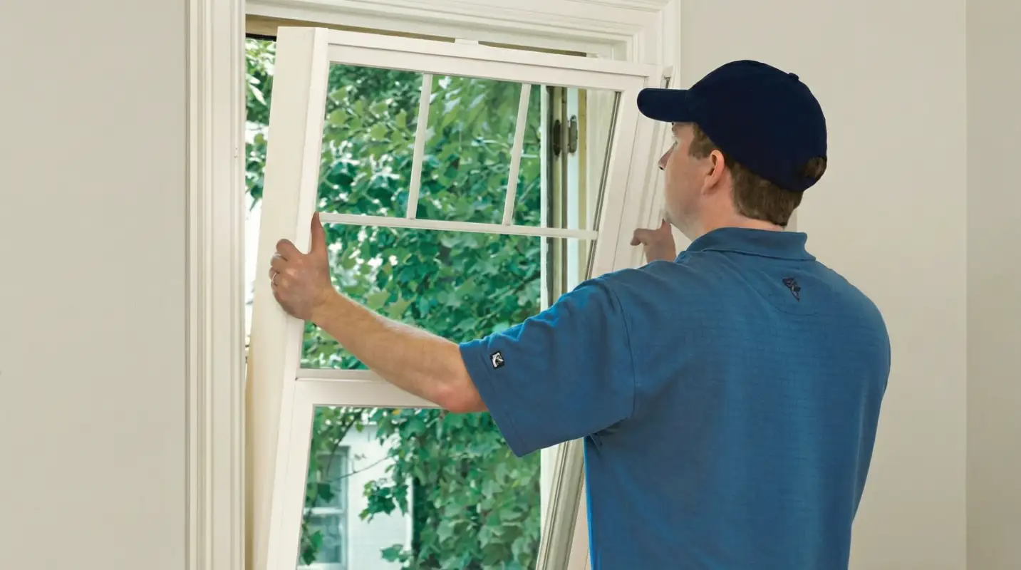 Professional contractors performing a residential window insulation and replacement service in Sioux Falls, SD